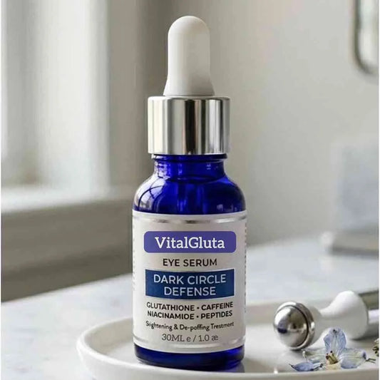 VitalGluta eye serum bottle on a white surface with a blurred background